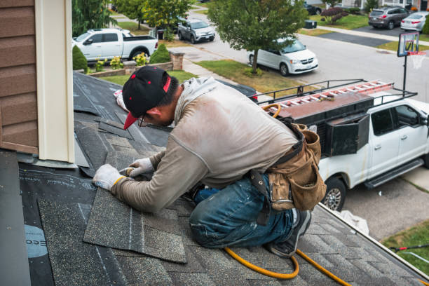 Professional Roofing technician working in Alvord, IA